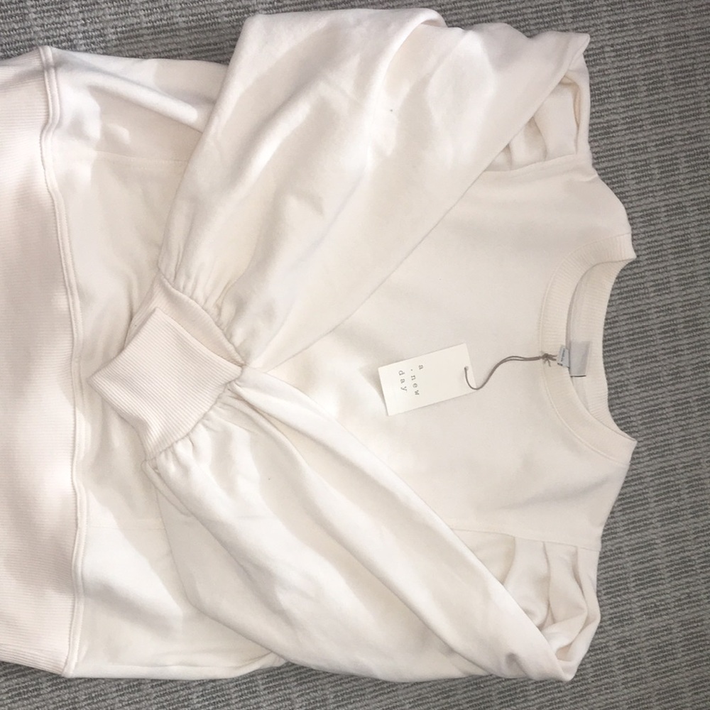 I am selling a cream crewneck from the brand A New Day